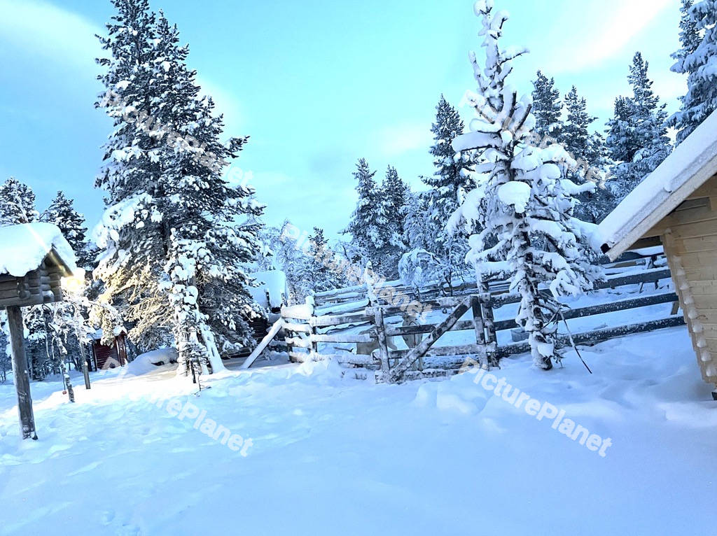 Snowy mountains with oranges houses